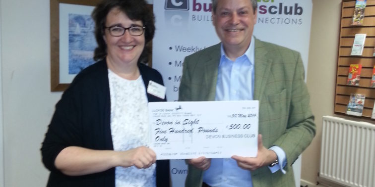 Grahame and lady holding a check